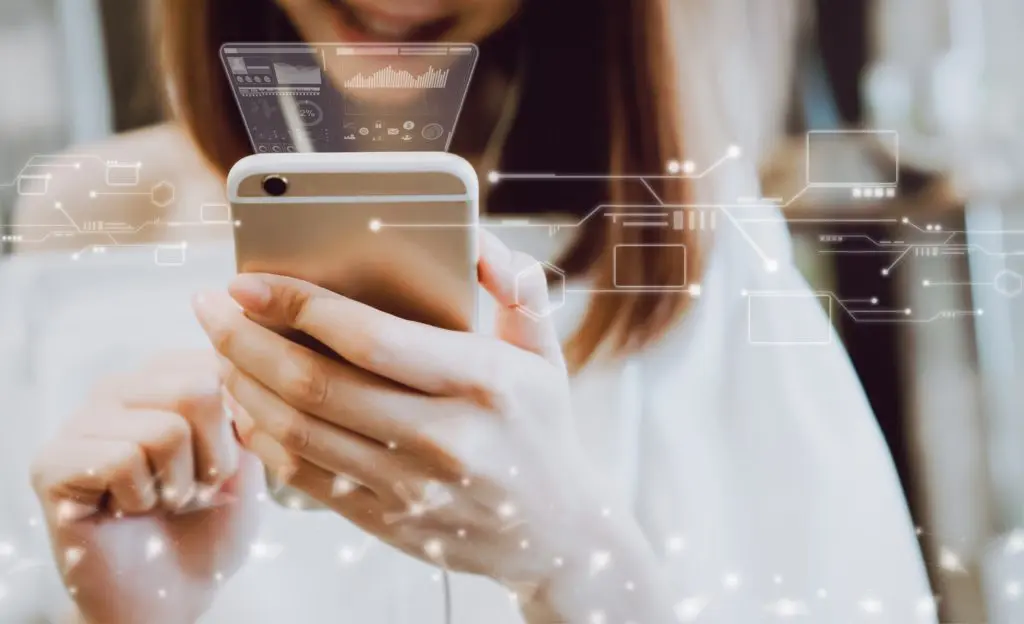 Girl texting on her smartphone with virtual computers and networks in the background. Signifies texting a business- using business SMS- and unified communications.