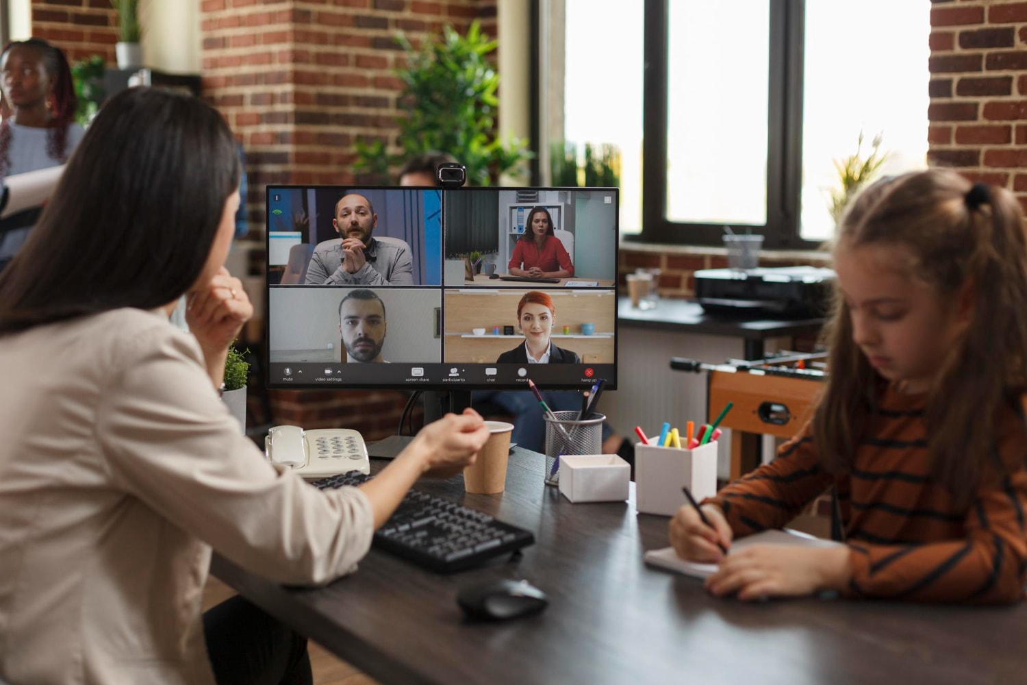 A business person on a remote meeting call using a Video Conferencing system